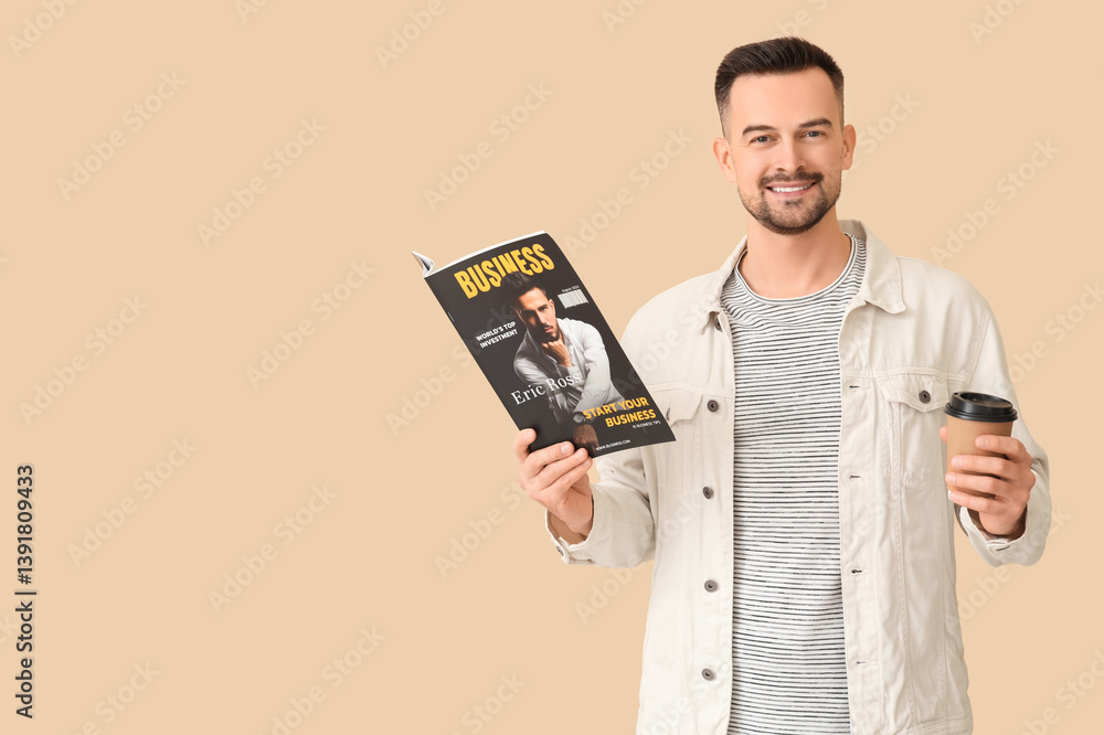 Handsome man with coffee cup reading magazine on beige background