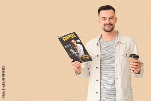 Obraz na płótnie Handsome man with coffee cup reading magazine on beige background w salonie