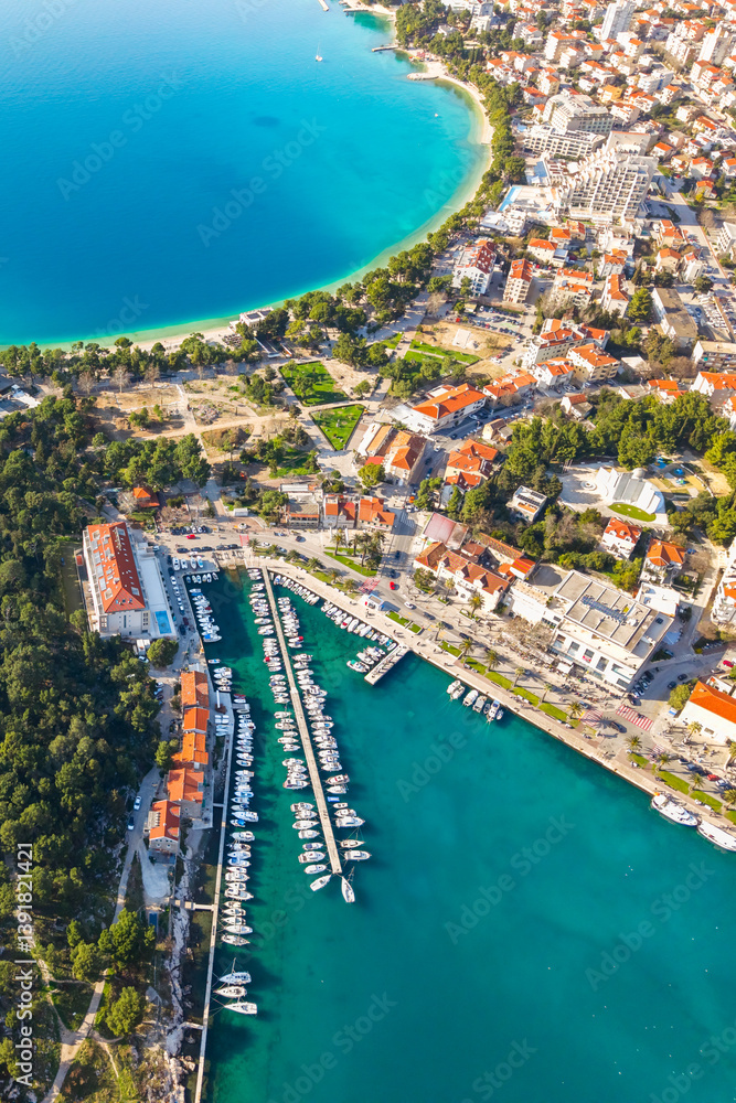 Obraz premium Aerial view of Makarska town, marina with boats and yachts. Dalmatia region, Croatia