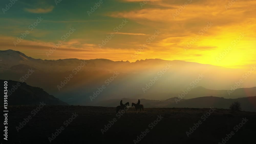 Two people are riding horses in a picturesque sunset. The sky is filled with warm hues of orange, pink, and purple, creating a serene and tranquil atmosphere Two people are riding horses in a picturesque sunset. The sky is filled with warm hues of orange, pink, and purple, creating a serene and tranquil atmosphere