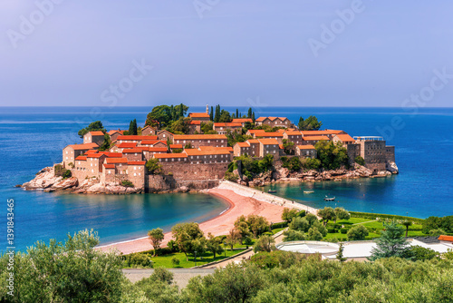 beautiful summer landscape of amazing resort on amazing island with yellow ancient walls and orange tile roofs among sea vawes and nice blue sky on background