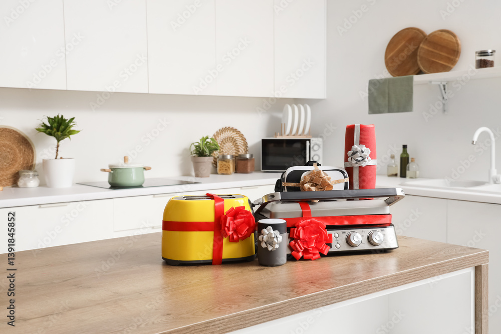 Different household appliances on counter as gift in kitchen