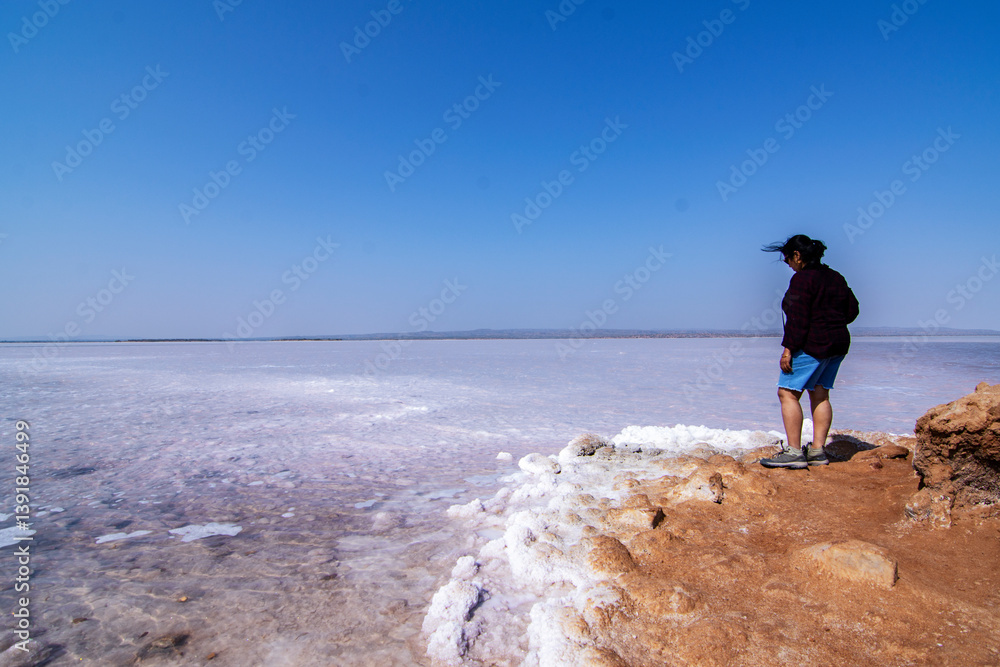 Solo Female Traveler Enjoying Raw Nature on Road to Heaven in White Desert of Rann of Kutch