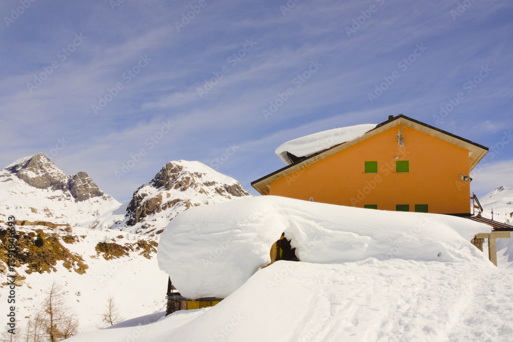 The Rifugio Calvi (Calvi Alpine hut), in the heart of the Orobie Alps (Bergamo Alps), where the 'Trofeo Parravicini', the famous ski mountaineering race, takes place every year. The Rifugio Calvi (Calvi Alpine hut), in the heart of the Orobie Alps (Bergamo Alps), where the 'Trofeo Parravicini', the famous ski mountaineering race, takes place every year.