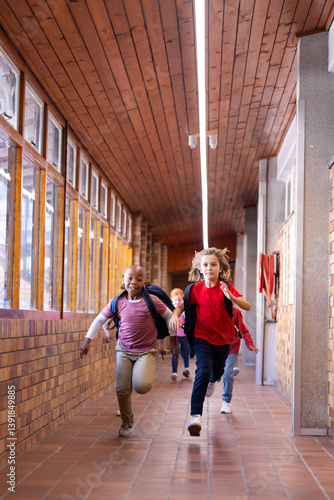 Running in school hallway, diverse children with backpacks enjoying recess time, copy space