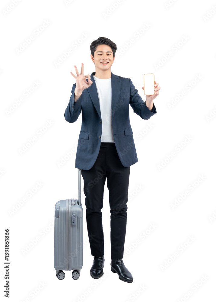 Full body image of young asian businessman pulling suitcase and using phone Full body image of young asian businessman pulling suitcase and using phone