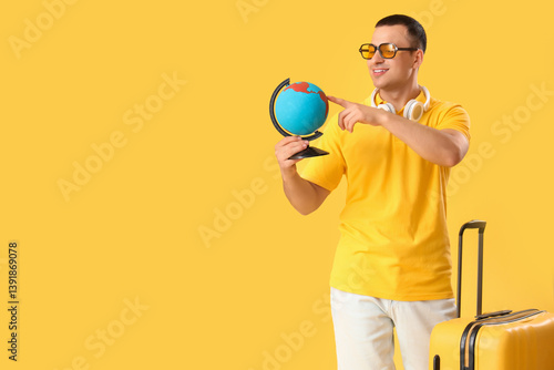 Male tourist with suitcase ...