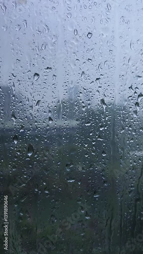Rain on the window glass of the building