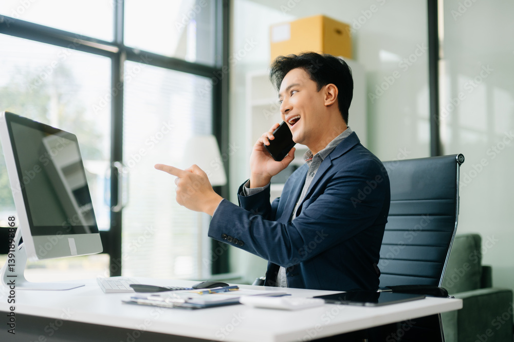 Asian businessman are delighted and happy with the work they do on their tablet, laptop and taking notes Asian businessman are delighted and happy with the work they do on their tablet, laptop and taking notes