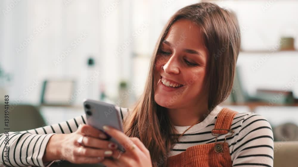 Happy, woman and laughing with phone at house for communication, social media and reading blog. Female person, mobile app and contact for feedback, funny message and weekend update for notification Happy, woman and laughing with phone at house for communication, social media and reading blog. Female person, mobile app and contact for feedback, funny message and weekend update for notification