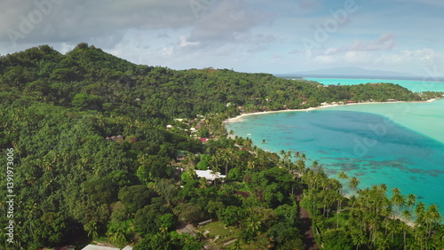 Obraz na płótnie Drone footage revealing breathtaking tropical island beauty with lush greenery, pristine turquoise waters, sandy beaches, and swaying palm trees for a serene getaway w salonie
