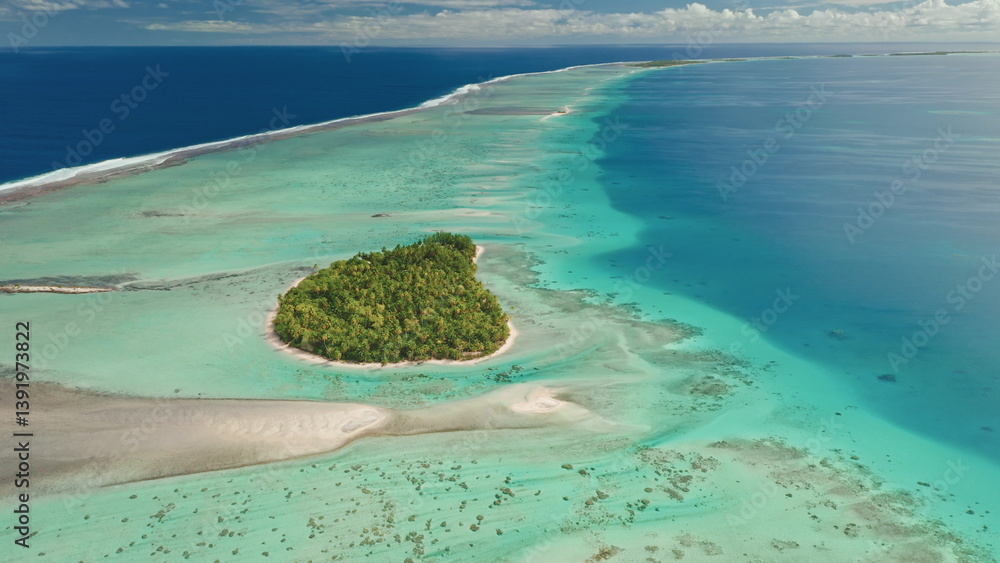 This stunning vista showcases a tropical island lush with greenery, surrounded by clear turquoise waters. Coral reefs are visible beneath the surface, providing a breathtaking view of nature's beauty.