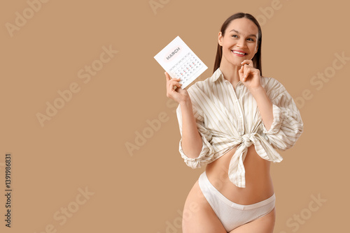 Thoughtful young woman with...