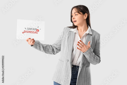 Upset businesswoman holding...