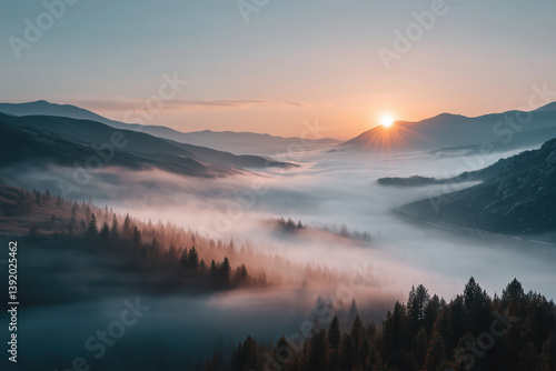 Wallpaper Mural Misty sunrise over mountain ridges and dense valley forest with golden sunlight.

 Torontodigital.ca