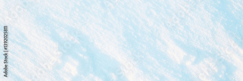 Obraz na płótnie Wide panoramic winter background with snowy ground. Natural snow texture. Wind sculpted patterns on snow surface. w salonie