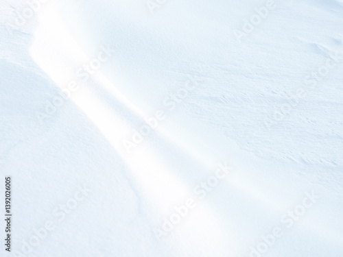 Obraz na płótnie Beautiful winter background with snowy ground. Natural snow texture. Wind sculpted patterns on snow surface. w salonie