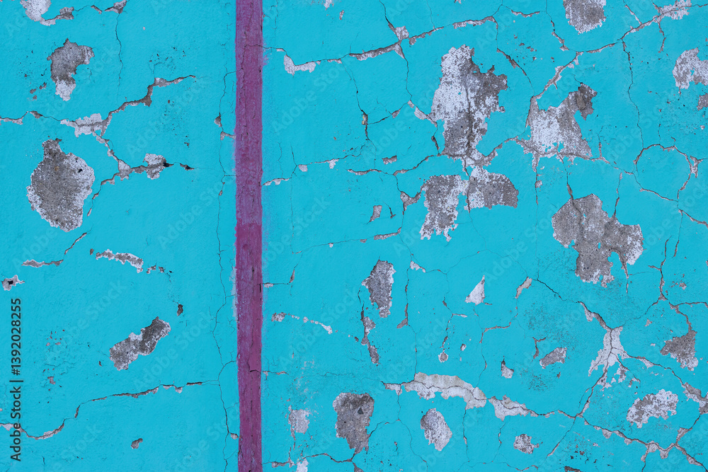 Peeling paint on the wall. Old concrete wall with cracked flaking paint. Weathered rough painted surface with patterns of cracks and peeling. Grunge texture for background and design. High resolution.