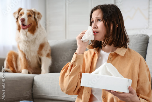 Young sneezing woman and do...