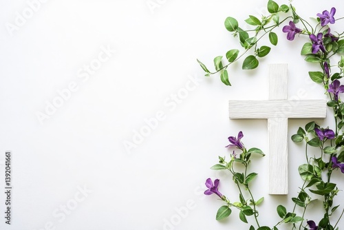 Wooden Cross with Purple Flowers and Green Vine on White Background