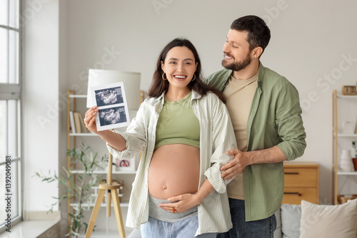 Happy pregnant couple with ...