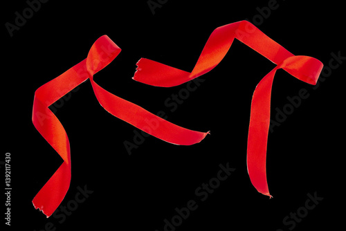 Delicate Red Wavy Ribbon Isolated on a black Background. 