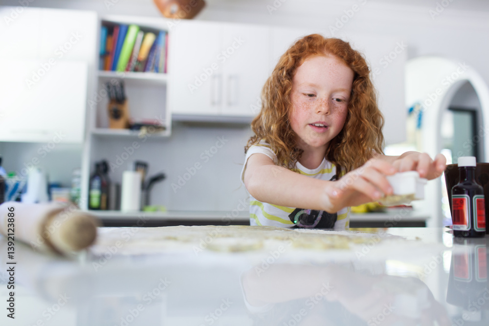Girl baking biscuits in the kitchen Girl baking biscuits in the kitchen