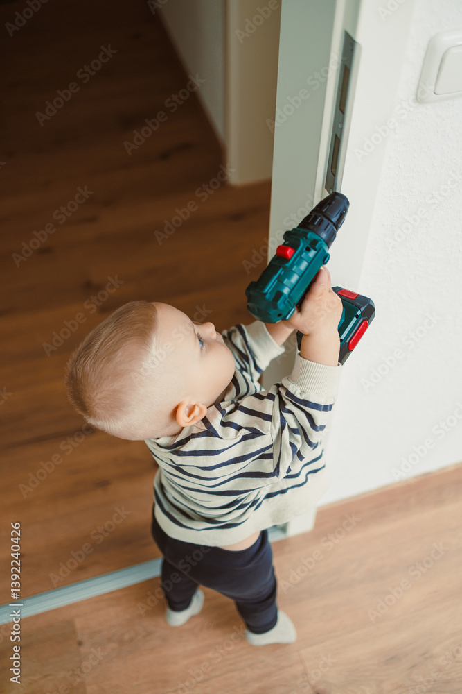 Toys for little children. Toddler boy playing with educational toy. Child playing with toy beads in kindergarten or nursery. Toddler child in nursery.