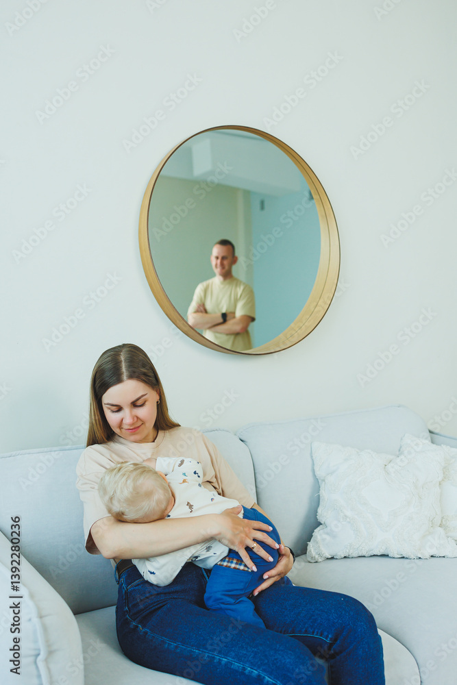 A heartwarming moment at home shows a mother breastfeeding her newborn, with the fathers gentle reflection in the mirror adding warmth to the scene, embodying family life and deep connections