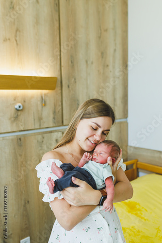 Obraz na płótnie Tender Moments A New Mother Cuddling Her Newborn Baby in a Cozy Hospital Room, Filled with Love and Emotional Bonding, Celebrating the Joyful Experience of Parenthood and New Life w salonie