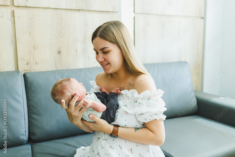A Heartwarming Scene A Loving Mother Gently Holding Her Precious Baby in a Cozy and Inviting Living Room, Surrounded by an Atmosphere of Comfort and Warmth That Embodies Family Togetherness