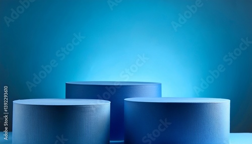 three blue cylinder podiums against matching background