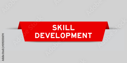 Red color inserted label with word sill development on gray background