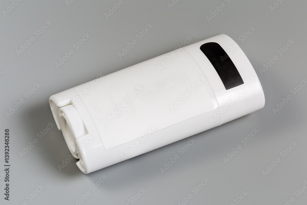 Container of solid deodorant on a gray background Container of solid deodorant on a gray background