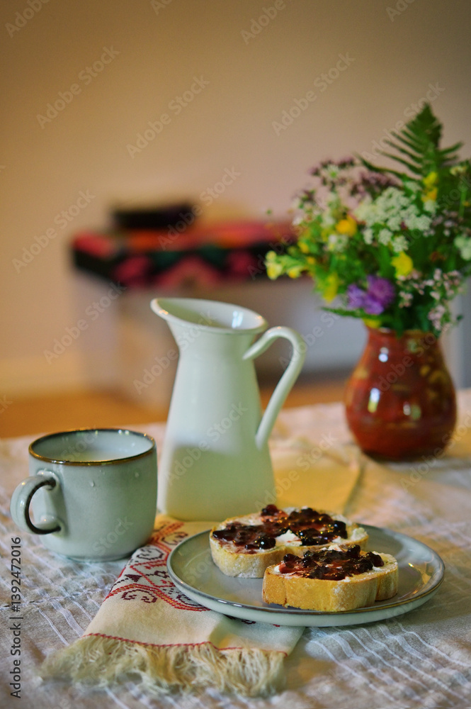 Romanian tradional food background Bread toast with plum jam with milk