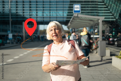 Obraz na płótnie An elderly lost woman is navigating the airport area with a map in hand, looking for her next destination. The GPS location pin icon is placed on the image to emphasize her use of digital navigation w salonie