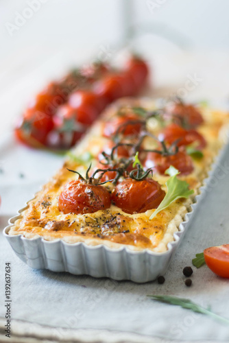 ppetizing chicken and tomato quiche with melted cheese on a flaky crust. Perfect for food blogs, recipes, and ads. Top view, close-up, and sliced shots. Natural lighting, rustic style, selective focus