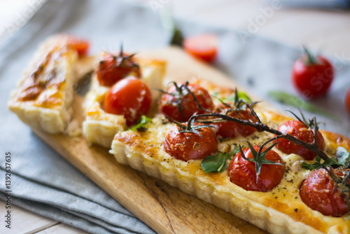 ppetizing chicken and tomato quiche with melted cheese on a flaky crust. Perfect for food blogs, recipes, and ads. Top view, close-up, and sliced shots. Natural lighting, rustic style, selective focus