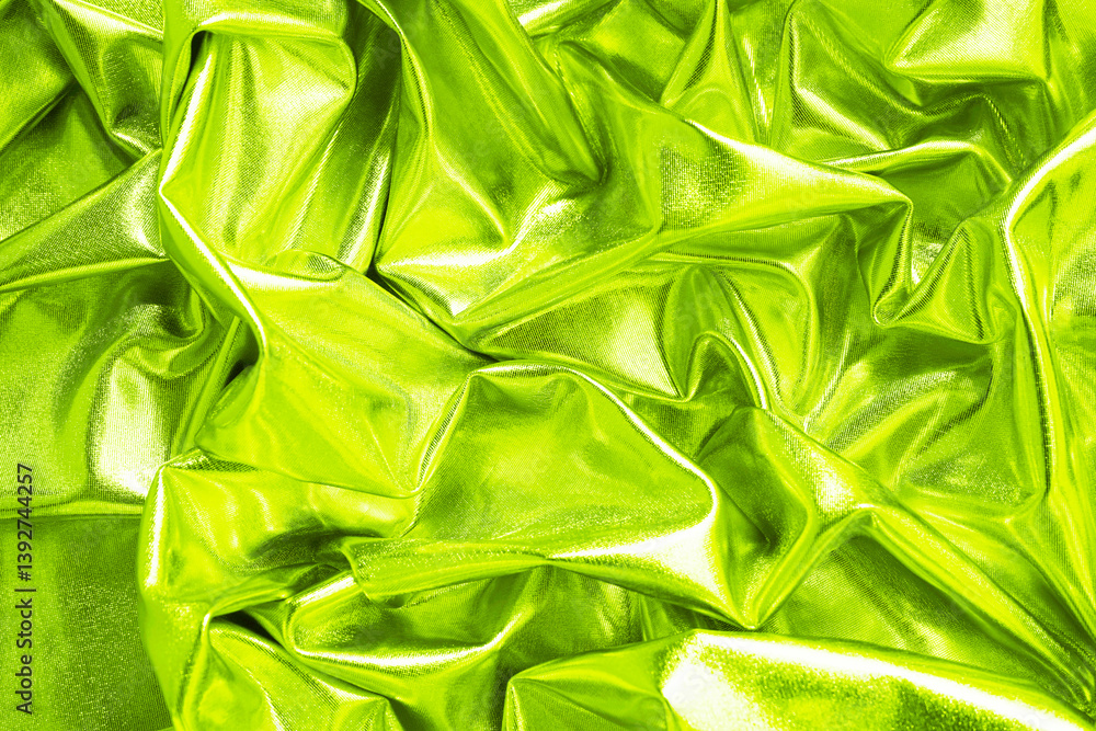 Light green yellow lime abstract shiny fabric background. Bright vivid color. Shine sparkle glitter liquid fluid metal metallic foil. Fold ripple drapery. Design. Luxury style beauty glamour festive.