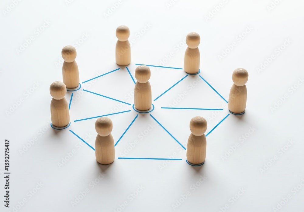 Fototapeta premium Wooden figures connected by blue lines in a circular star pattern on white background symbolizing teamwork and distributed systems