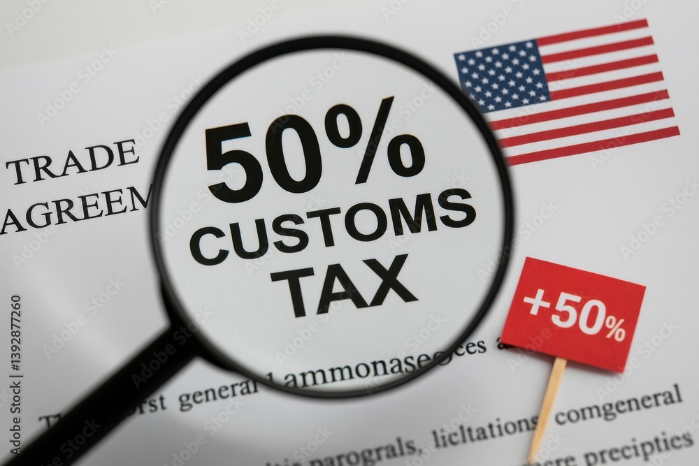 Magnifying glass showing 50% customs tax increase on trade agreement with usa flag Magnifying glass showing 50% customs tax increase on trade agreement with usa flag