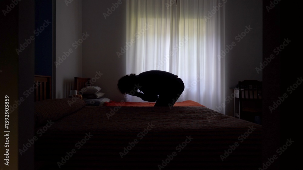 Desperate man in depression at home in bedroom despairs and cries for failure and panic attack and anxiety, loneliness and desperation lifestyle in apartment after economic crisis