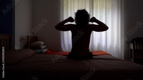 Obraz na płótnie Man wakes up in the morning and gets out of bed to open the window curtains and look out of the house ready to start a new day - lifestyle in apartment w salonie