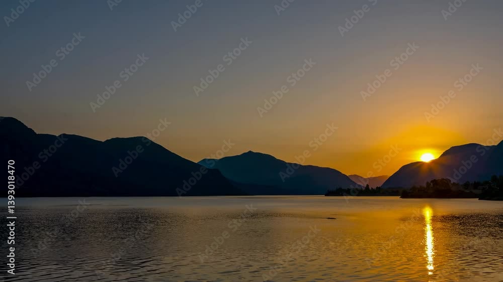 Serene Twilight Landscape with Mountains Over Reflective Water and Dark Sky Colors at Dusk Serene Twilight Landscape with Mountains Over Reflective Water and Dark Sky Colors at Dusk