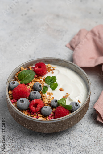 yogurt with granola, oatmeal, raspberries, mint, blueberries, breakfast