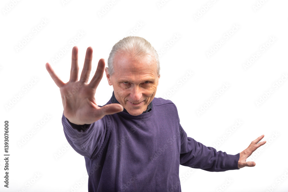 Senior man showing stop sign with hand and smiling Senior man showing stop sign with hand and smiling