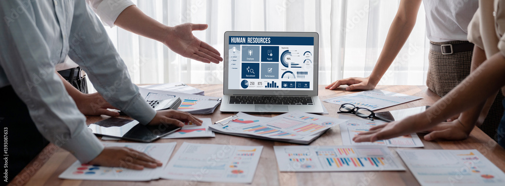 Human resources management software on computer screen helping human resources employee to manage recruitment, payroll, staff searching and KPI evaluation brisk