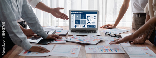 Human resources management software on computer screen helping human resources employee to manage recruitment, payroll, staff searching and KPI evaluation brisk
