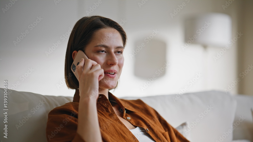 Woman talking cellphone couch relaxing at cozy domestic weekend closeup. Woman talking cellphone couch relaxing at cozy domestic weekend closeup.