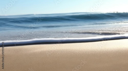 Ocean Waves Crashing on Sandy Beach: A Serene Coastal Scene